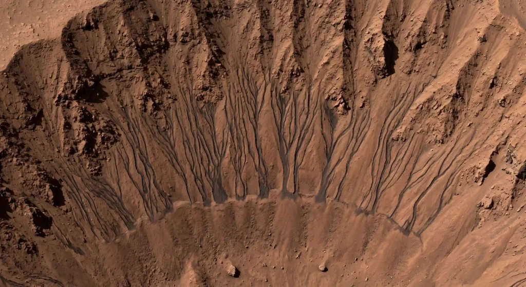High-resolution image of dark seasonal streaks on a steep Martian slope, once thought to be liquid water seeps.